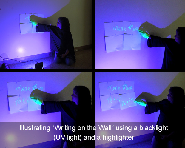 Illustrating writing on the wall using a uv blacklight and highlighter on white paper fixed to a white wall